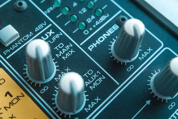 Photo of the analog audio mixer of the sound producer close up