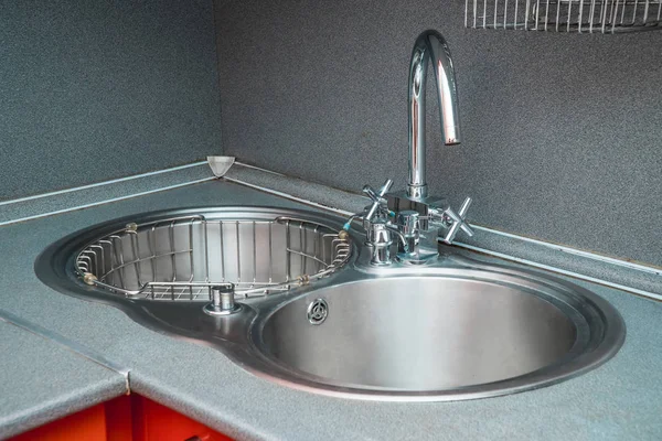 The photo of a sink in a The photo of a sink in a  kitchen — Stock Photo, Image