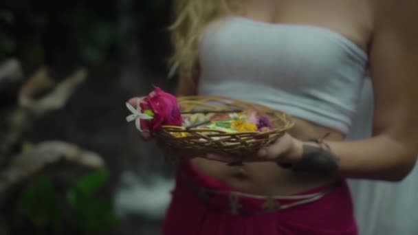 Video Young Girl White Top Red Pants Holding Basket Flowers — Stock Video