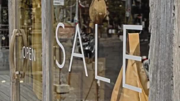 White Text Glass Window Store Inscription Sale — Stock Video