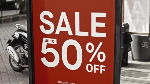 Red Sign Hanging Glass Window Inscription Sale — Stock Video