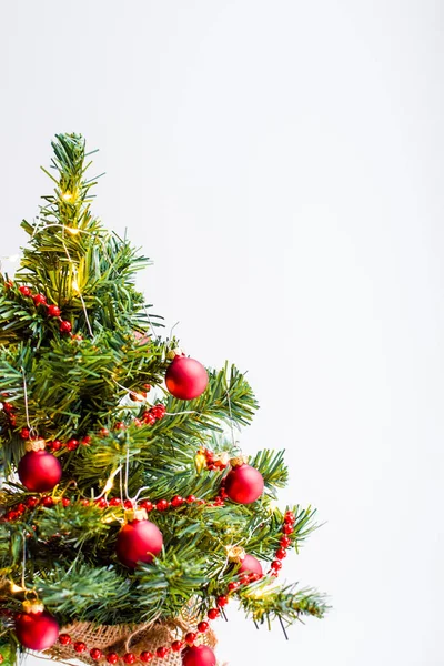 Small Green Christmas Tree Decorated Garland Luminous Lights Red Balls — Stock Photo, Image