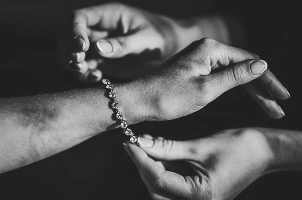 Bridesmaid Helping Put Bracelet Arm Bride Royalty Free Stock Images