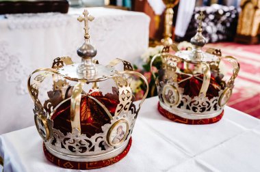 Wedding crowns in church ready for marriage ceremony clipart
