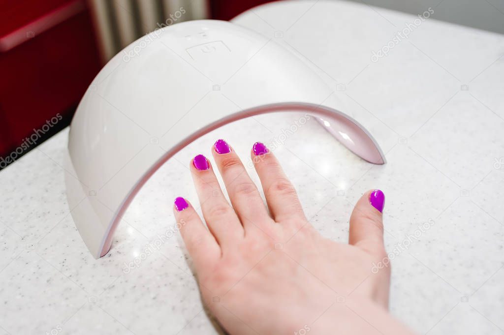 Close view of woman making manicure at home