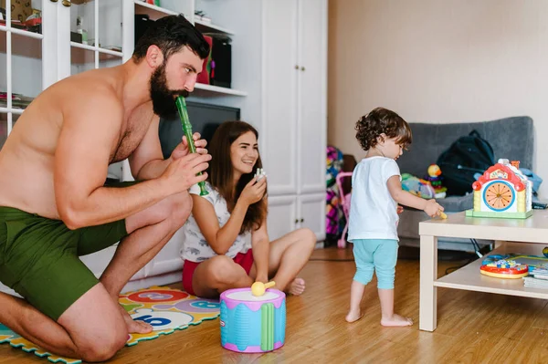 Mom Dad Daughter Hold Toys Playing Game Room Indoor Home — Stock Photo, Image