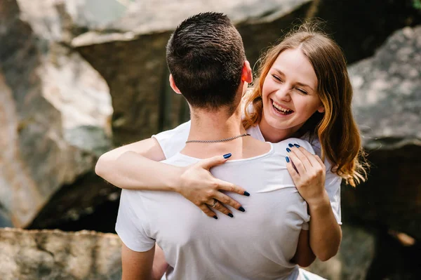 Woman Hugs Her Husband Back Her Hands Young Couple Stand — Stock Photo, Image