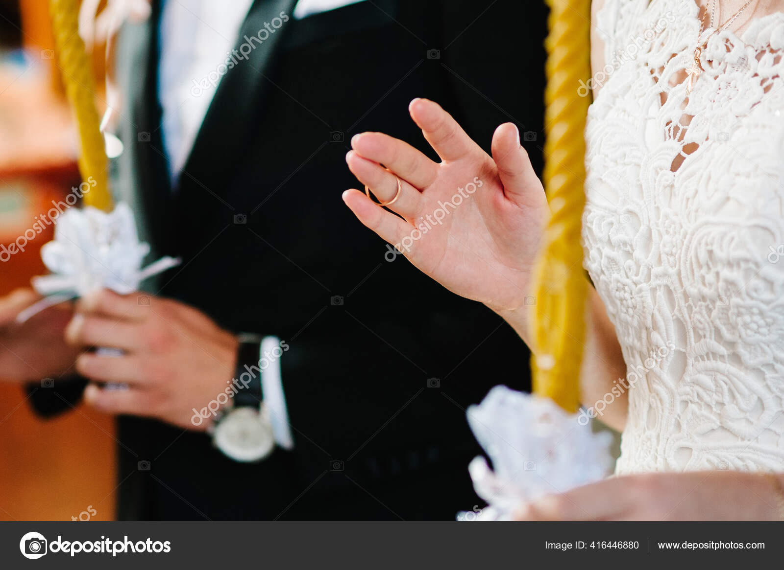 Premium Photo | Close-up of the hand of the groom puts a wedding ring on  the brides finger, the ceremony on the street, selective focus