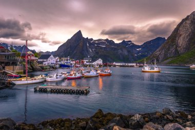 Reine - June 14, 2018: Little fishing harbor in the beautiful village of Reine in the Lofoten Islands, Norway clipart