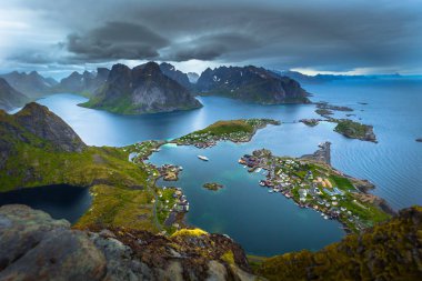 Panoramic view of the fishing town of Reine from the top of the Reinebringen viewpoint in the Lofoten Islands, Norway clipart