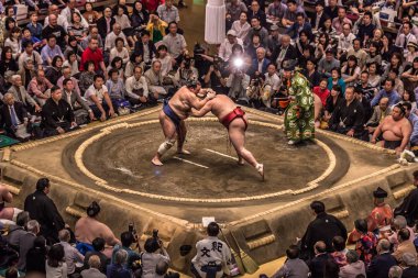 Tokyo - May 19, 2019: Sumo wrestling match in the Ryogoku arena, clipart