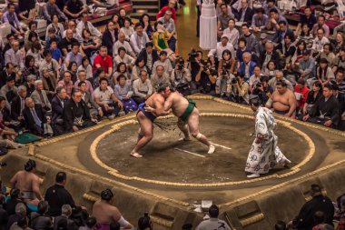 Tokyo - May 19, 2019: Sumo wrestling match in the Ryogoku arena, clipart
