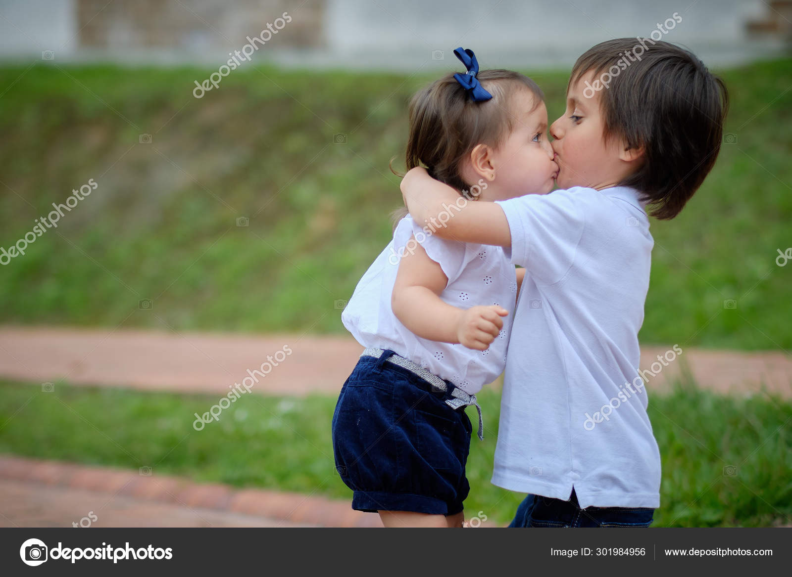 Big Brother Hugging His Younger Sister And Giving Her A Kiss Of Affection Stock Photo Image By C A35mmporhora 301984956