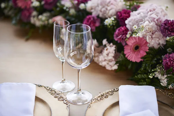 Elegant table with two glasses and two dishes for weddings or events