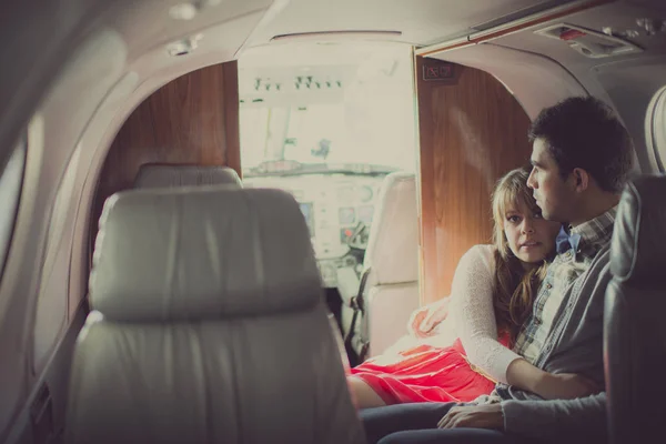 Romantic couple traveling in a private plane. Love and travel concept 2