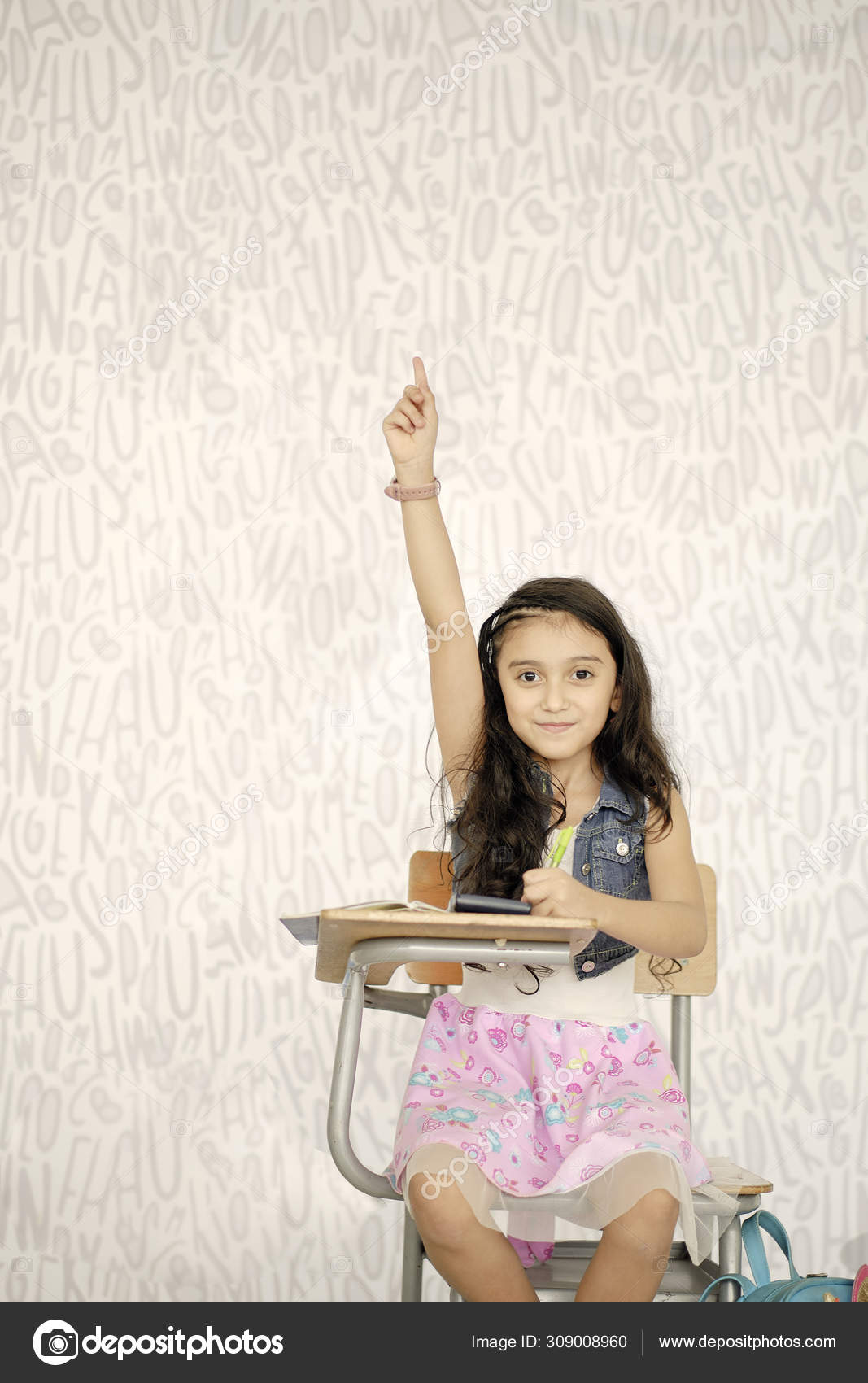 Lonely Girl Sitting At A Desk Raising Her Hand To Participate In