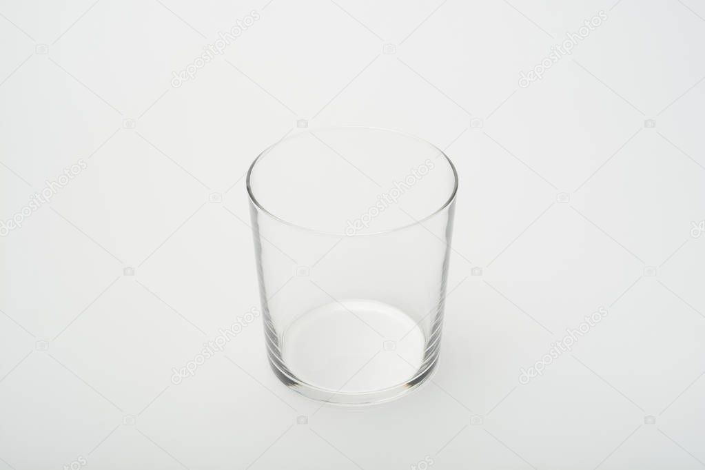 Empty crystal glass on white background