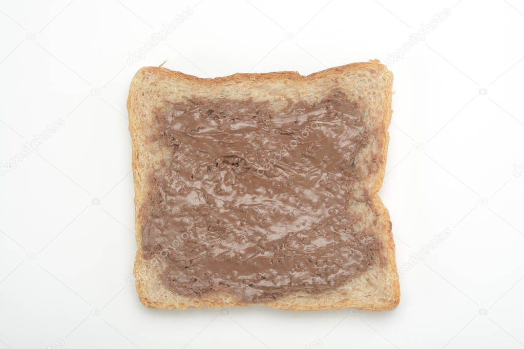 Toast with chocolate cream on white background