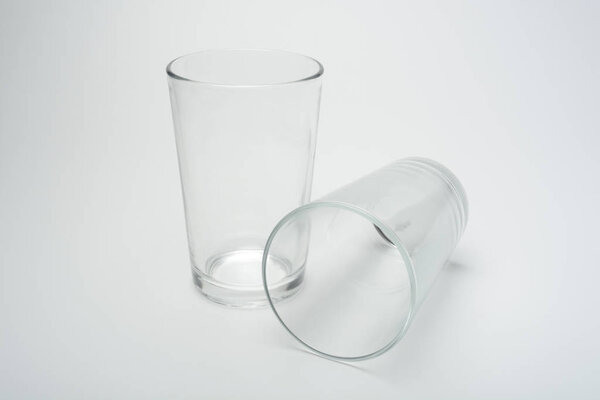close-up shot of empty glasses on white surface