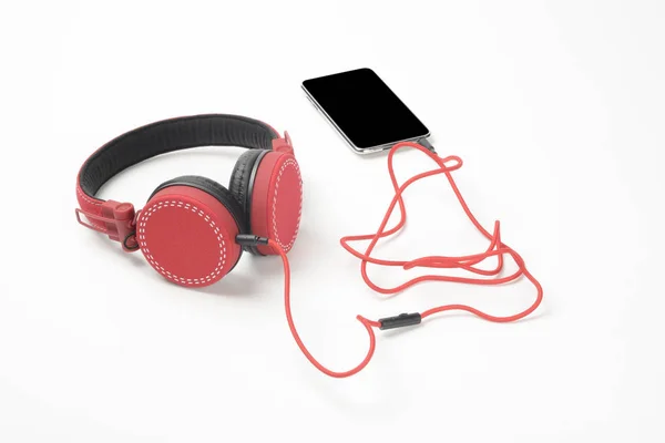 Headset vermelho e telefone — Fotografia de Stock