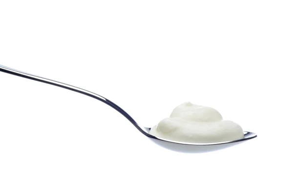 Йогурт на ложке — стоковое фото