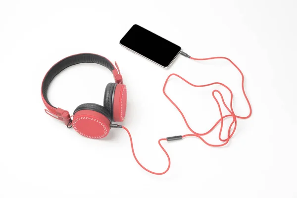 Auriculares y teléfono rojos — Foto de Stock