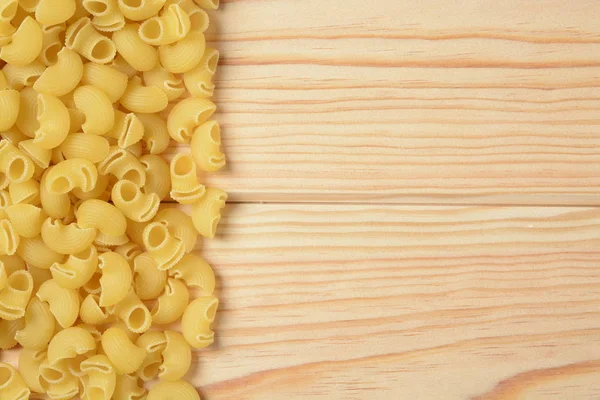 Raw pasta shaped elbow