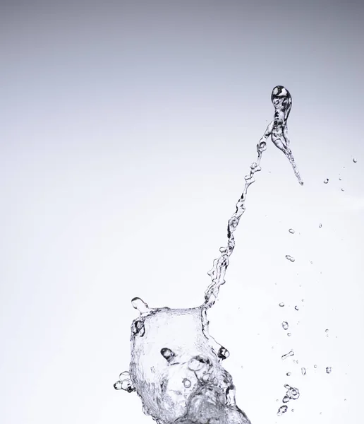 Moving water on white background — Stock Photo, Image