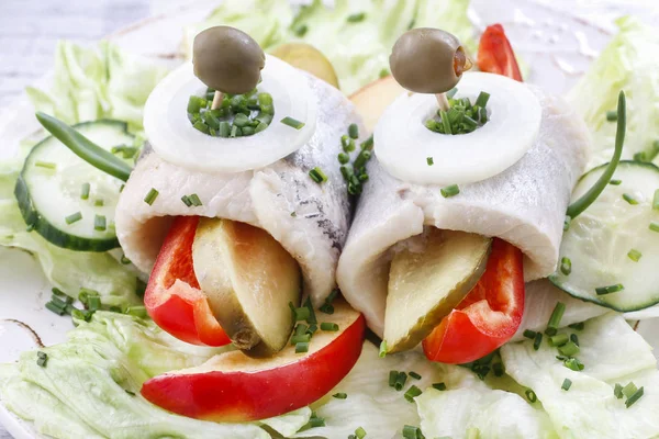 Pickled herring rolls. Party dish