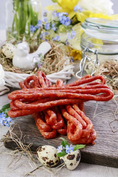 Smoked sausage on the table — Stock Photo, Image