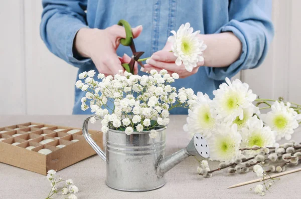 How to make floral arrangement  inside silver watering can. East — Stock Photo, Image