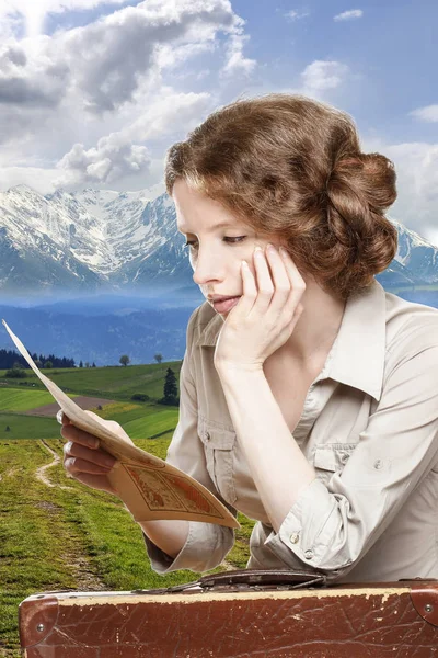 Retro styled portrait of young woman reading a map with vintage — Stock Photo, Image