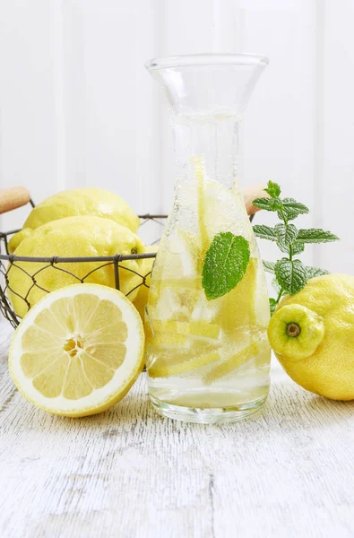 Lemonade in glass bottle and ripe fruits. — Stock Photo, Image