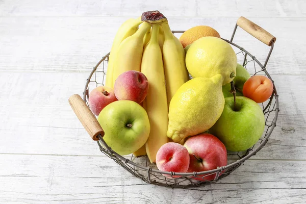 Stack of fruits on wooden table. — Stock Photo, Image