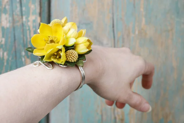 Wrist corsage made of yellow flowers. — Stock Photo, Image