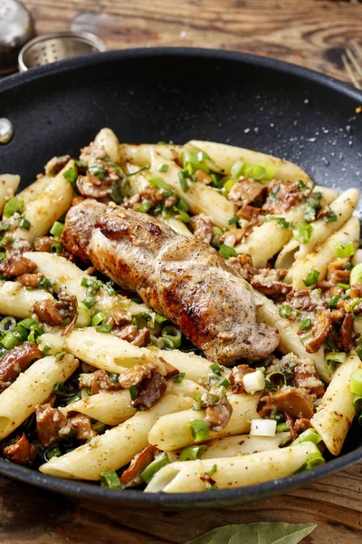 Baked pork chop with penne pasta — Stock Photo, Image