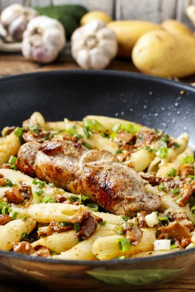 Baked pork chop with penne pasta — Stock Photo, Image