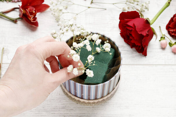 How to make simple floral arrangement with red orchids