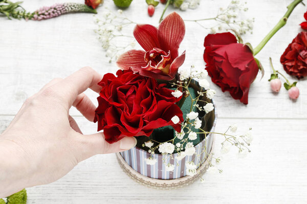 How to make simple floral arrangement with red orchids