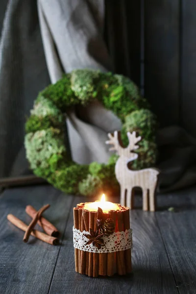 Candle decorated with cinnamon sticks. Christmas time — Stock Photo, Image