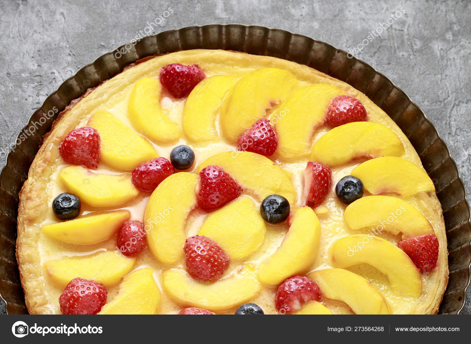 Peach, strawberry and blueberry cake. Stock Photo by ©agneskantaruk