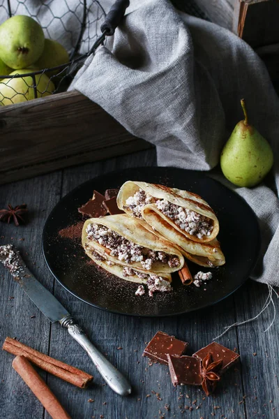 Crepes filled with chocolate and cottage cheese.