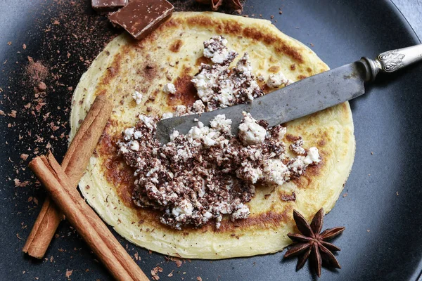 Crepes filled with chocolate and cottage cheese.