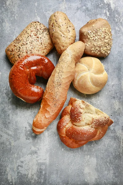 Assorted buns on grey stone background. — Stock Photo, Image