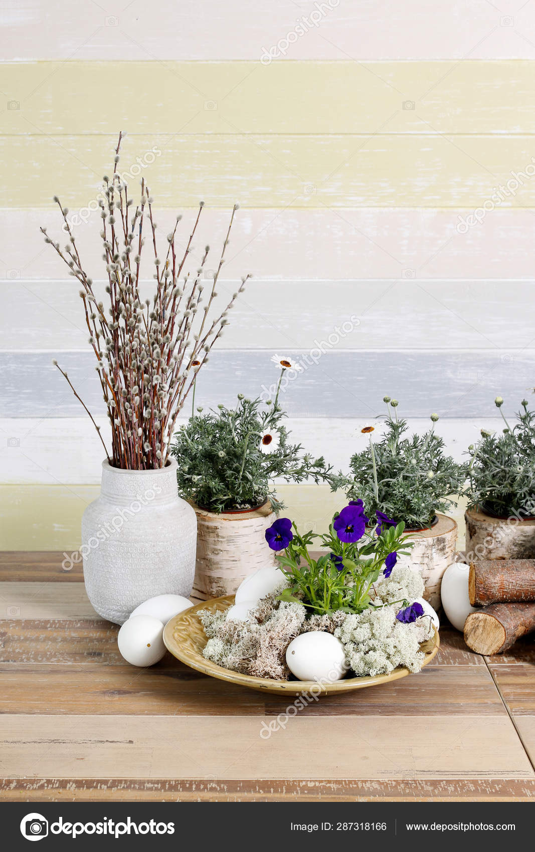 Easter Table Decorations With Pansy Flower Moss Eggs And Bunch