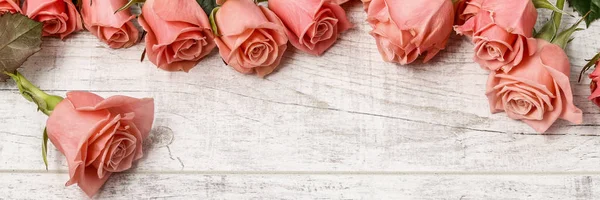 Big bouquet of roses on wooden background