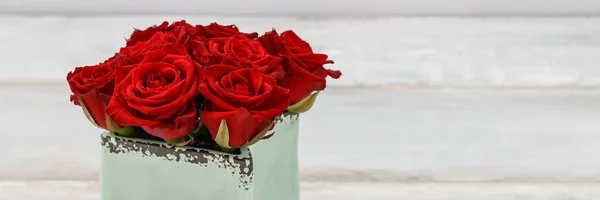 Flower box with red roses.