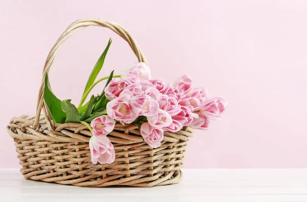 Huge bouquet of pink tulips in wicker basket. Postcard motif — Stock Photo, Image