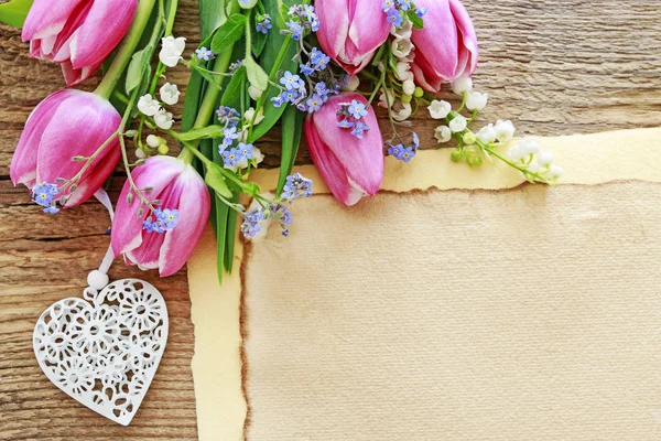 Bouquet of pink tulips, lily of the valley and forget me not flo — Stock Photo, Image