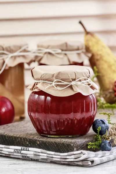 Glass jar with red jam. Homemade food. Sweet autumn dessert. — Stock Photo, Image